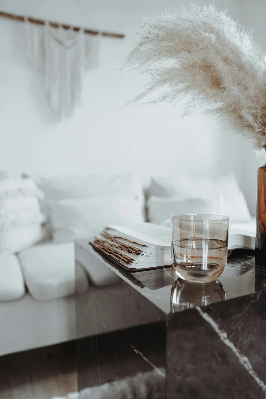 Reed diffuser with rattan sticks releasing fragrance in a room